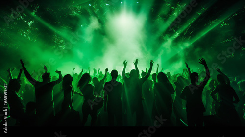 Silhouette of a party audience orange lights