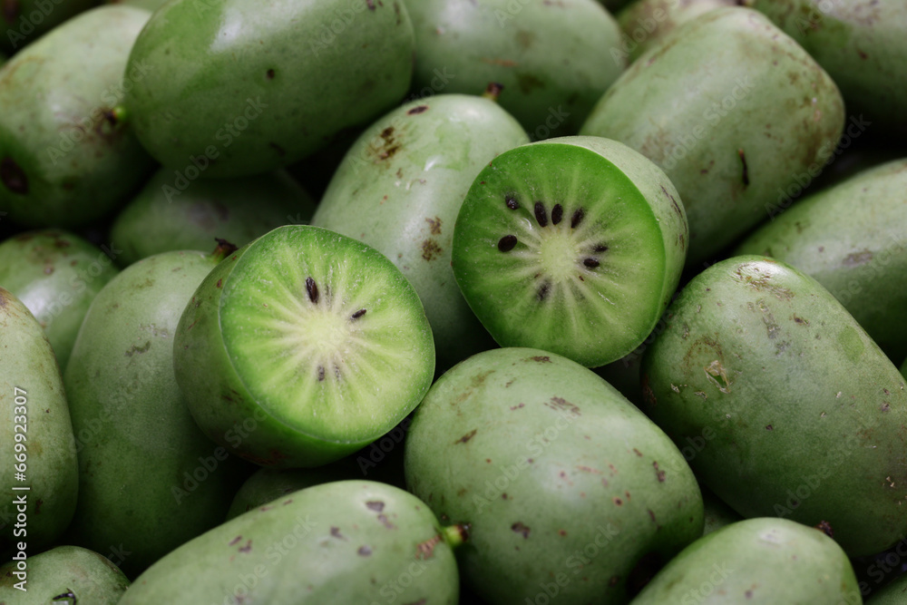 organic baby kiwi, cross-section, close up organic baby kiwi, cross-section, close up