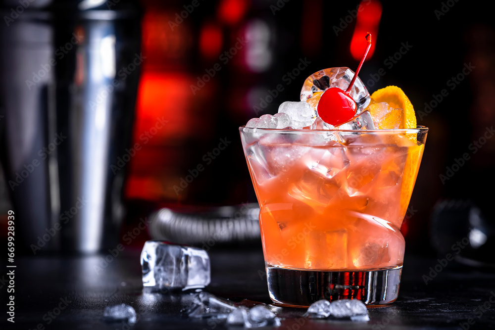 Matador cocktail drink with whiskey, vermouth, liqueur, bitter, grenadine, orange juice, cherry