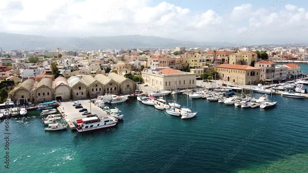 Cinematic aerial view of Chania city pier and downtown Cinematic aerial view of Chania city pier and downtown