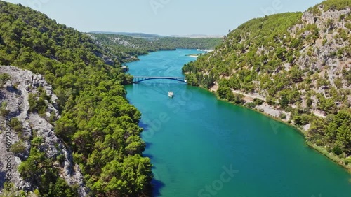 Wallpaper Mural Aerial flight through the national park of Krka in Croatia with the turquoise water. One bridge connects the banks. Torontodigital.ca