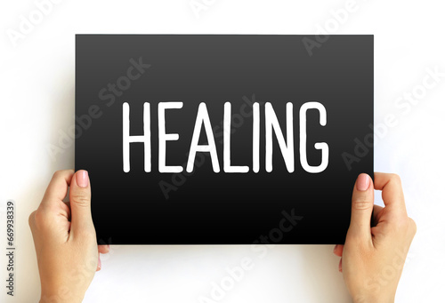 Healing - process of becoming well again, after a cut or other injury, text concept on card