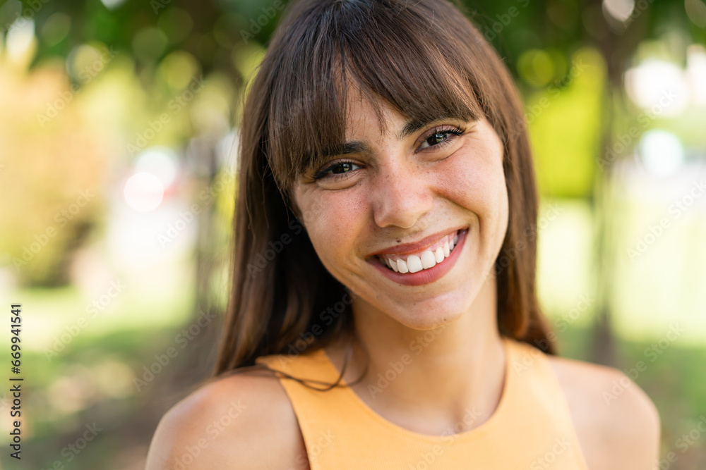 Young woman at outdoors With happy expression