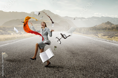 Young pretty businesswoman juggling with business items