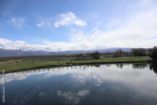 View of the Andes and its reflection in a lake in the Mendoza region, Argentina