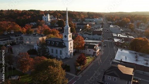 Circling around a church on main street at sunrise in October in Hudson, Massachusetts. photo