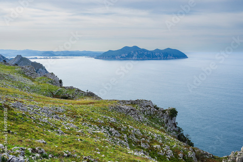 Buciero mount, ascent to Llanero arches (eyes of the devil), Pico Candina, Sonabia, Castro Urdiales, Cantabria, Spain photo