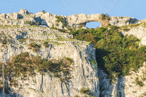 ascent to Llanero arches (eyes of the devil), Pico Candina, Sonabia, Castro Urdiales, Cantabria, Spain photo