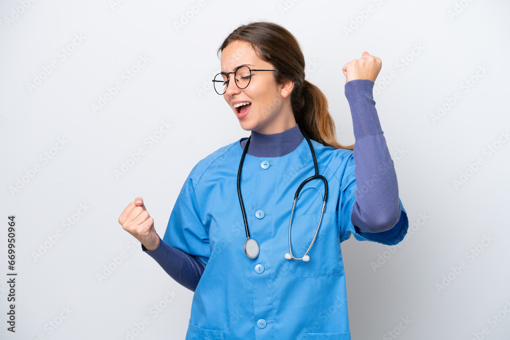Young caucasian nurse woman isolated on white background celebrating a victory Young caucasian nurse woman isolated on white background celebrating a victory