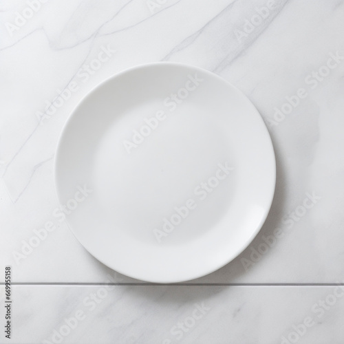 a white empty plate on a white marble table