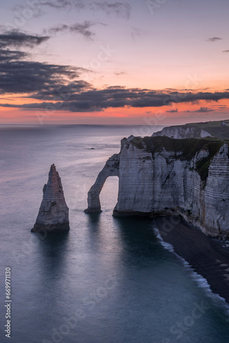 France, Normandy, Long exposure of Falaise dAval and Aiguille dEtretat rock formation at dawn photo