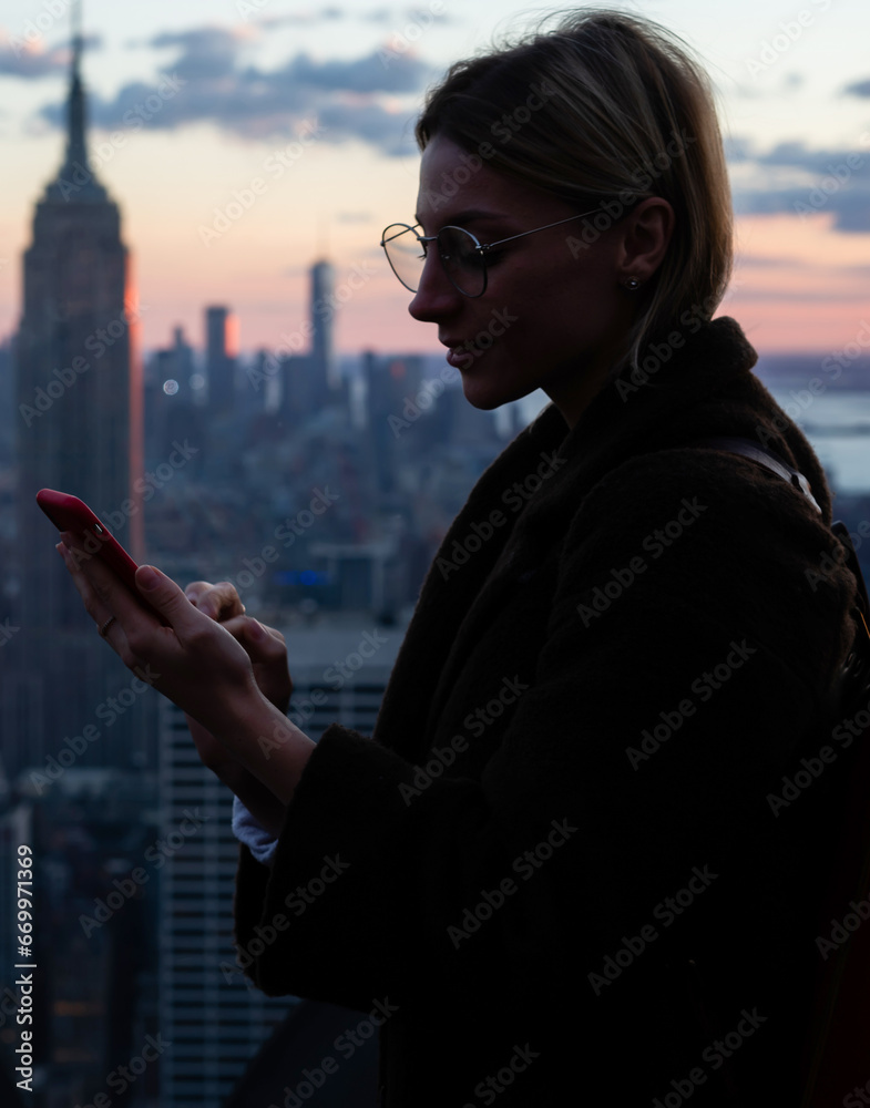 Fototapeta premium Female tourist publishing fresh photos for travel lifestyle blog