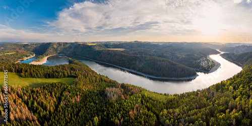 Germany, Thuringia, Panoramic view of bend of river Saale at sunset photo