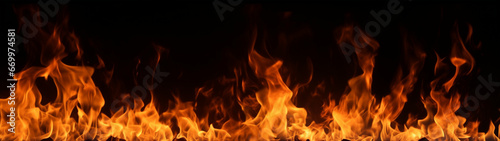 Fire flames effects with sparks isolated on black background,long banner of fire flames.