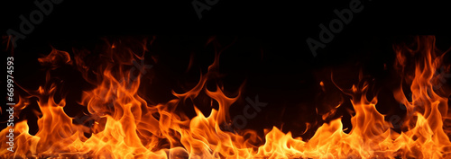 Fire flames effects with sparks isolated on black background long banner of fire flames.