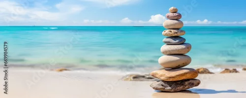 Obraz  z motywem tower of zen stones on paradise beach balance concept
