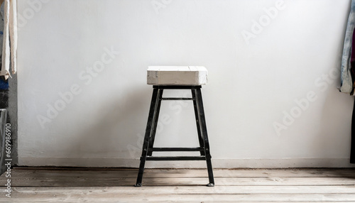 trendy stool with and build in storage side view white wall space