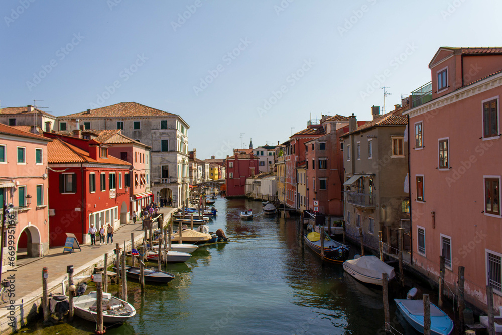 Chioggia town in venetian lagoon, water canal and boats. Veneto, Italy, Europe