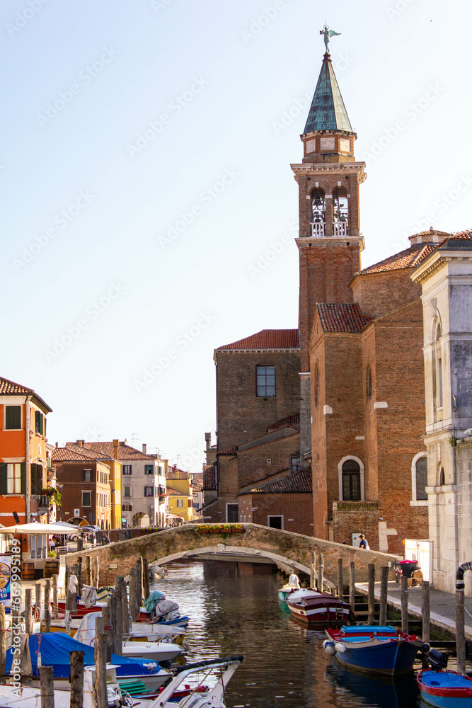 Chioggia town in venetian lagoon, water canal and church. Veneto, Italy, Europe