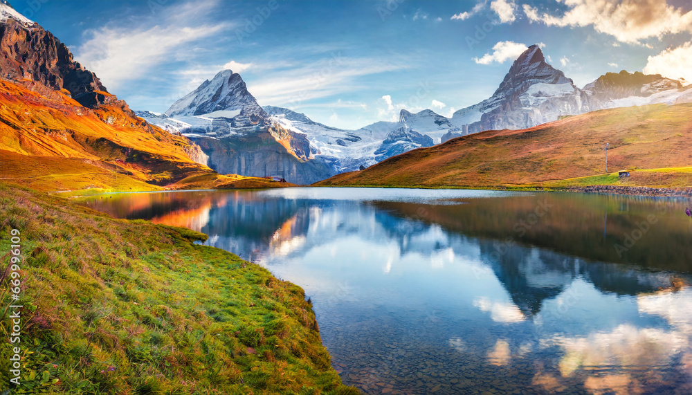 panoramic morning view of bachalp lake bachalpsee switzerland majestic autumn scene of swiss alps grindelwald bernese oberland europe beauty of nature concept background