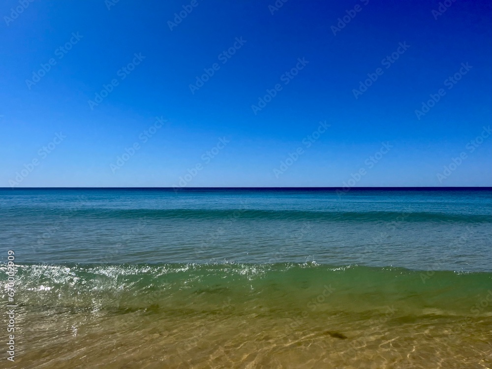 Transparent blue sea water, blue sea horizon, pure sky, natural blue seascape background Transparent blue sea water, blue sea horizon, pure sky, natural blue seascape background
