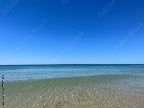 Transparent blue sea water, blue sea horizon, pure sky, natural blue seascape background