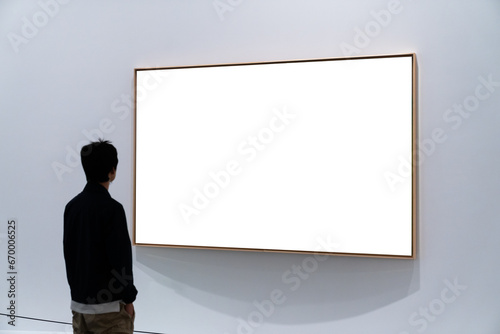 Audiences looking at oil paintings in gallery © THINK b