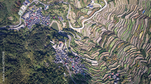 Drone flight above authentic rice terraces near Fuzhi mountain Dongcheng village at Shaoxin, Zhejiang provnice, China. High angle view of rice terrace fields in mountains.