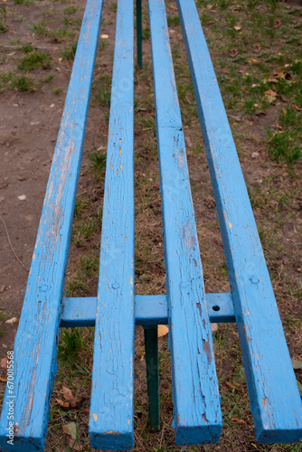 Blue city street bench made of individual boards,