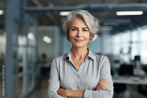 Leadership  portrait and business woman in the office with positive  happy and optimistic mindset  Happiness  smile and professional mature female executive boss standing with confidence in workplace