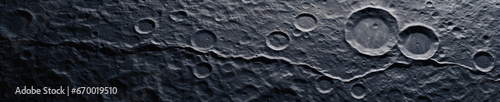 Captivating close-up of the moon's textured surface, revealing rocky craters and undulating terrain. photo