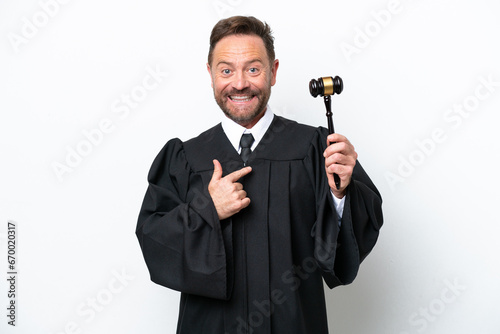 Middle age judge man isolated on white background with surprise facial expression