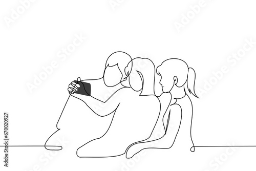 three people sitting looking at the phone screen - one line art vector. concept friends watching video on phone or filming themselves
