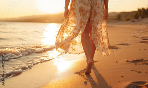 Woman strolling on beach at sunset.