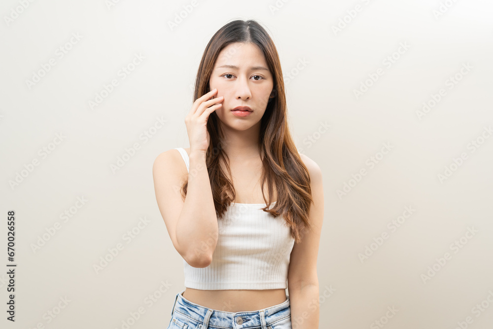 Fototapeta premium Dermatology, puberty asian young woman worry looking mirror, face allergic reaction from cosmetic, red or dark spot, rash. Beauty care skin problem treatment, blemish wrinkle, freckles from sunlight.