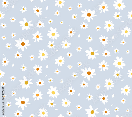 Seamless pattern with chamomile flowers on blue background