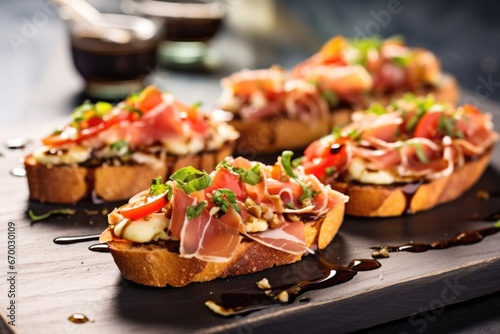 prosciutto bruschetta with visible grill marks served on a stone countertop