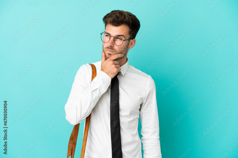Business man over isolated background having doubts and with confuse face expression Business man over isolated background having doubts and with confuse face expression