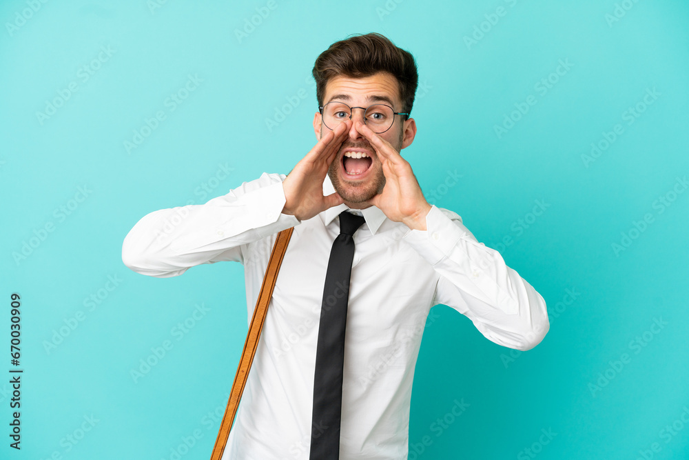 Business man over isolated background shouting and announcing something Business man over isolated background shouting and announcing something