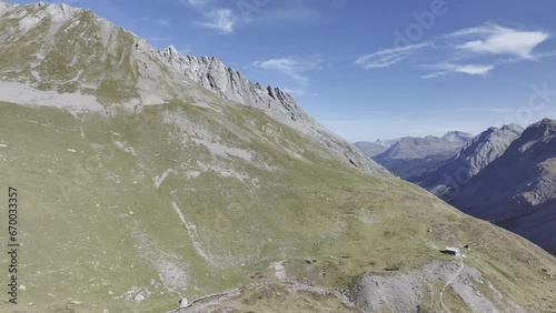 View to Alp Ramoz with Ramozhuette SAC and into Welschtobel, in the background Davos mountains with Weissfluh peak, drone image, Arosa, Grisons, Switzerland, Europe photo