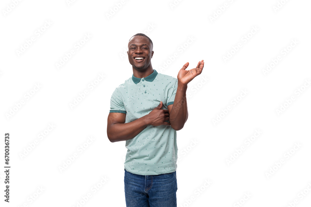 young short-haired american man dressed in a summer t-shirt points his hands to the sides to report the news young short-haired american man dressed in a summer t-shirt points his hands to the sides to report the news