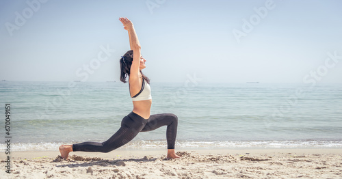 Fitness Girl working out on the beach