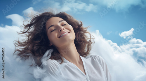 Sweet dreams: beautiful happy satisfied young woman having a good sleep and dreaming on a fluffy comfortable cloud bed.
