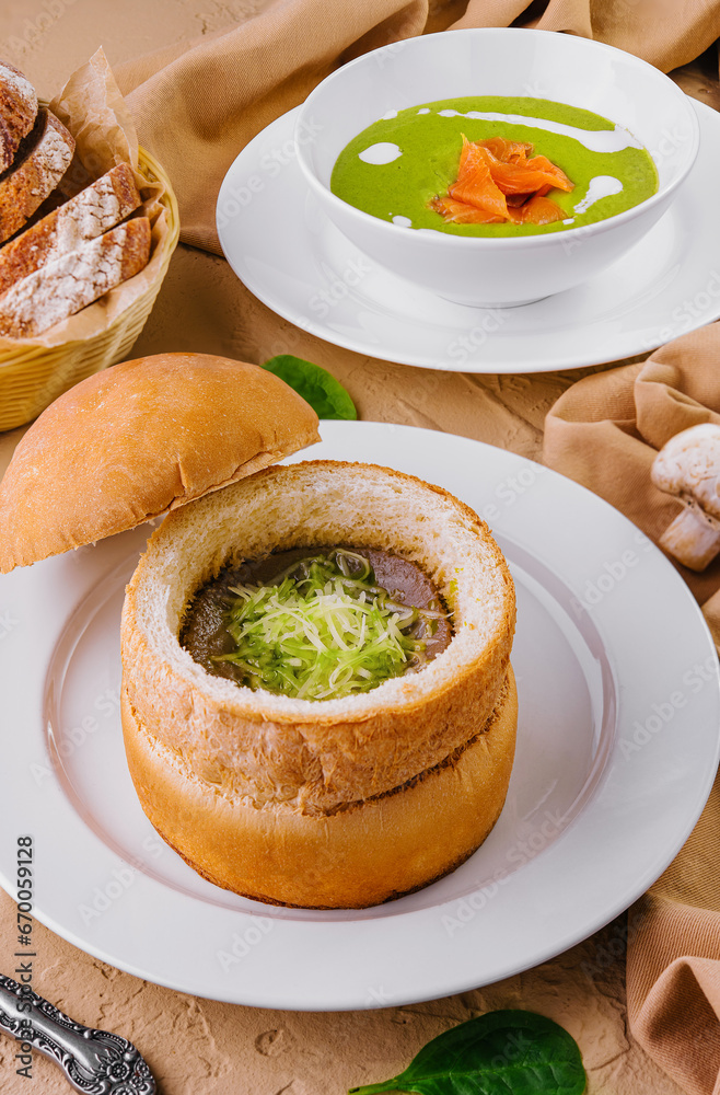 Spinach soup with red fish on top view Spinach soup with red fish on top view