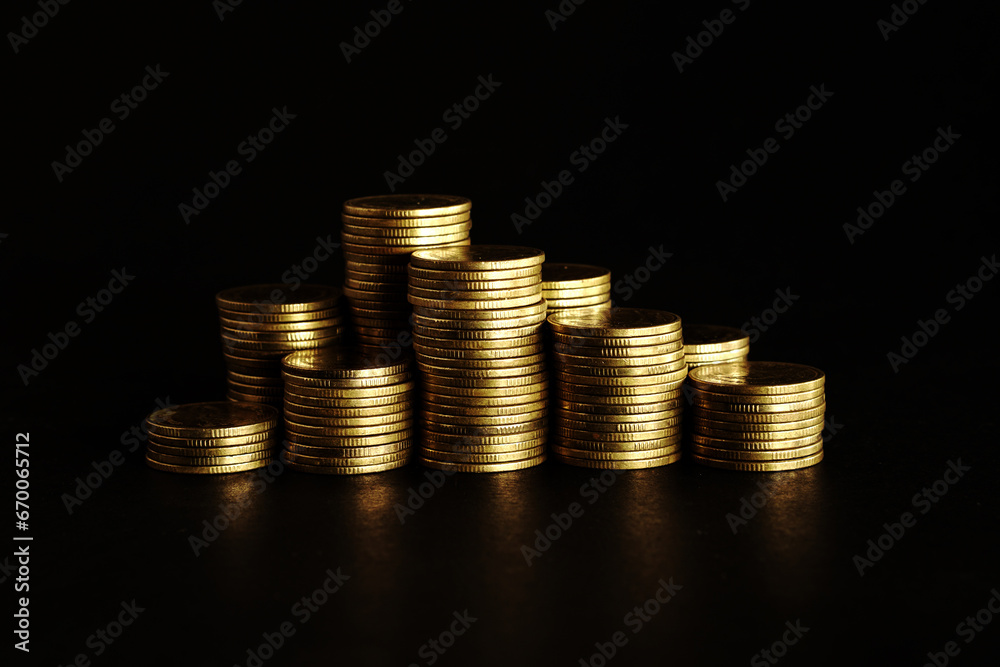 Gold coins on black background, Saving money concept Gold coins on black background, Saving money concept