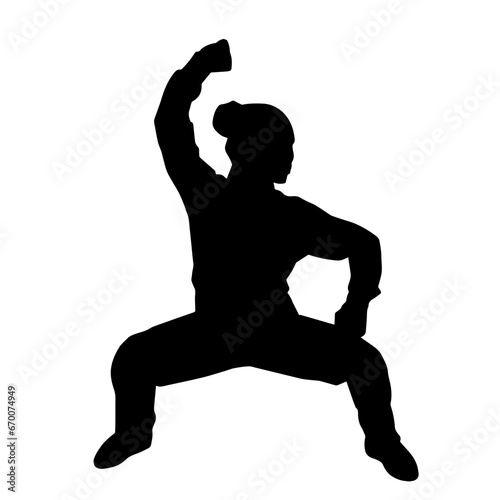 Silhouette of a female martial art person in action pose. Silhouette of a woman fighter in martial art pose.