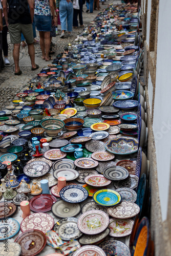 Artful Creations: Handcrafted Ceramic Plates Adorn the Street Market