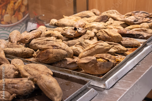 Baked Ubi Cilembu (Cilembu Sweet Potato) or Honey Sweet Potato, one kind of sweet potatoes that originated from Cilembu, West Java, Indonesia.  photo