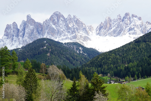 Landscape of Santa Maddalena and exterior village buildings at Val di Funes, land of the pale mountains and beautiful valley in the Dolomites also one of UNESCO World Heritage site- South Tyrol, Italy © chettarin