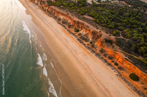 Praia da Falesia  Algarve beach in Albufeira  Portugal. Aerial drone view at sunset